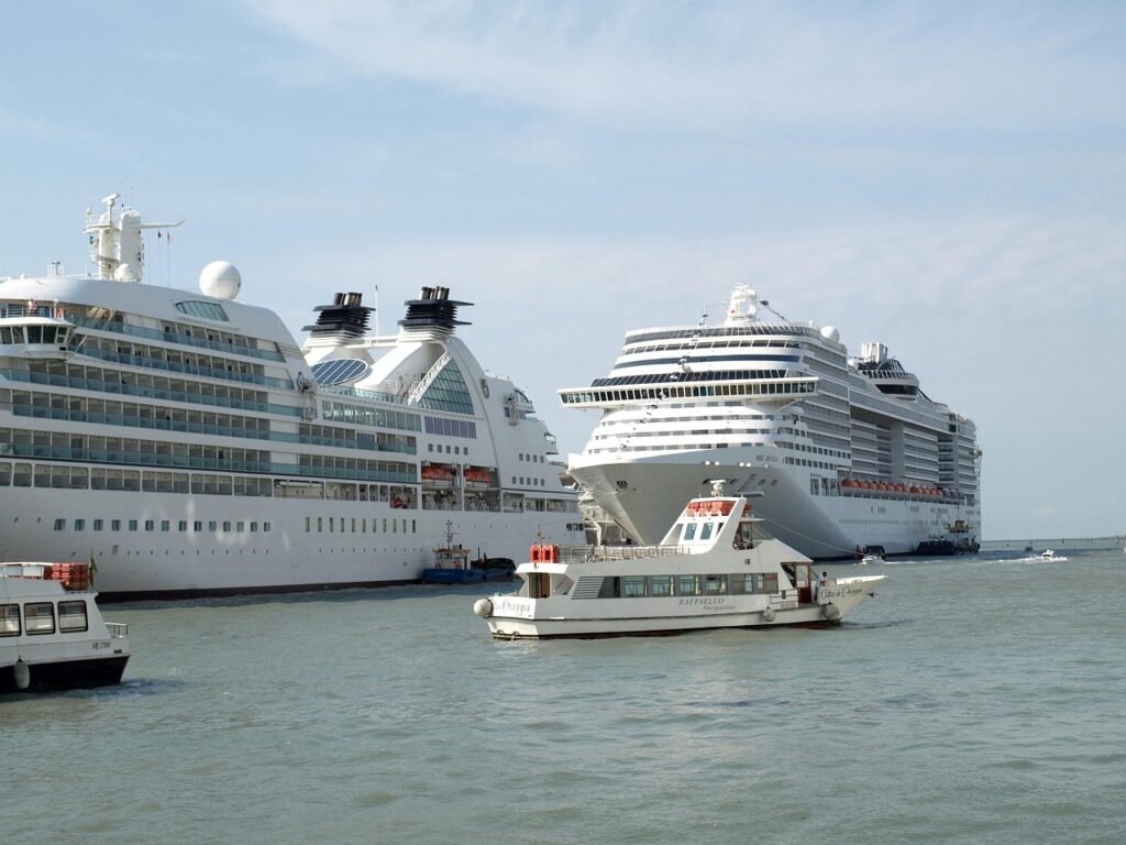 cruise passengers boarding tender boat from ship platform