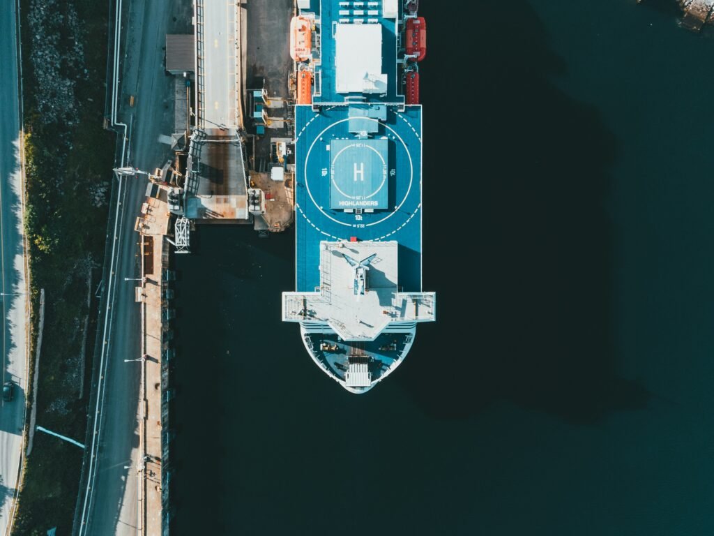 Cruise crew explaining emergency procedures to passengers during the muster drill