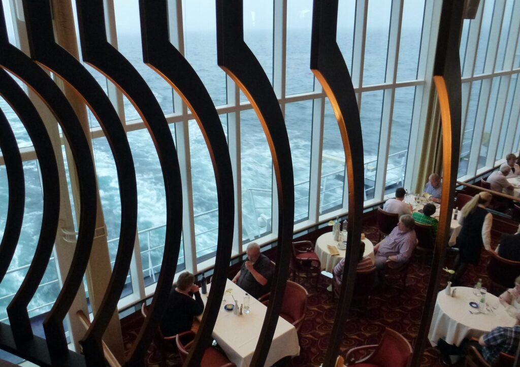 main dining room on a cruise ship prepared for dinner service