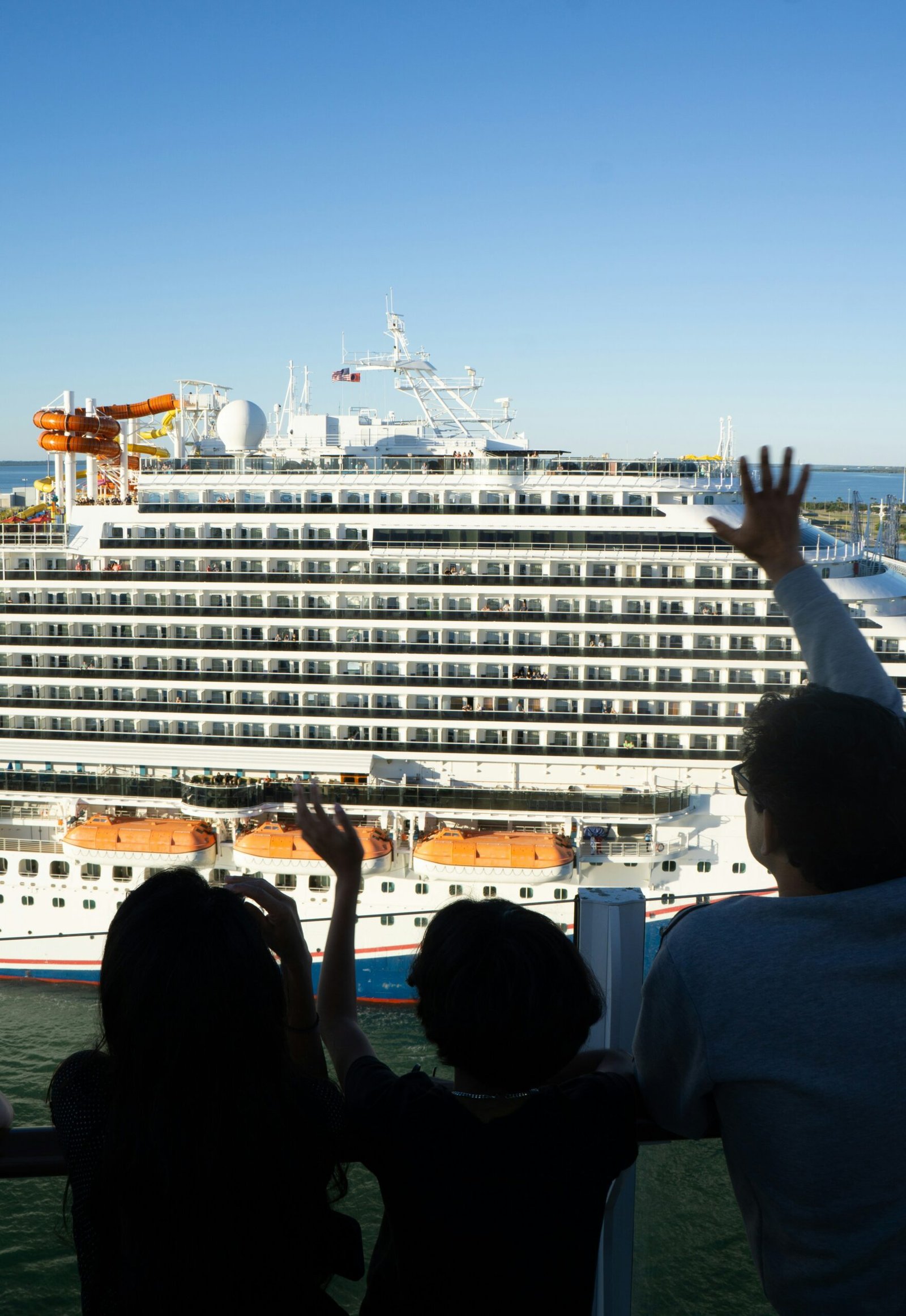 cruise ship sailaway leaving the port at sunset