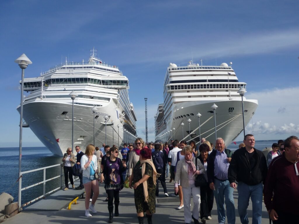 cruise passengers looking at ship from port worried about returning on time excursion